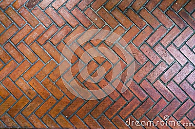 The path paved with red brick in herringbone pattern, Red stone walkway herringbone style pattern close-up Stock Photo