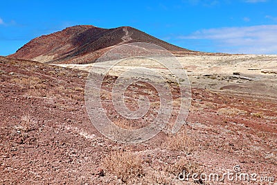 Path through red rocks mountains in El Medano, Tenerife, Spain Stock Photo