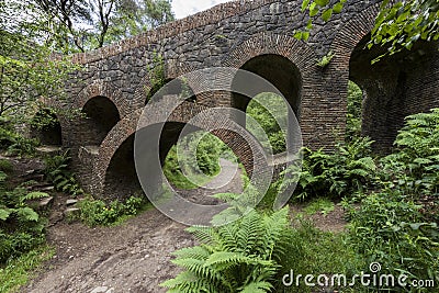 Path under seven arched bridge at Rivington Terraced Gardens Stock Photo