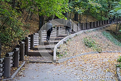 Paths reinforced with wooden structures on the steep slopes of Vorobyovy Gory, autumn 2020, Moscow Editorial Stock Photo