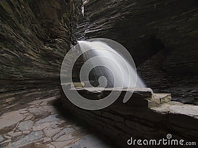 pathway behind a waterfall called cavern cascade at watkins glen state park in new york Stock Photo