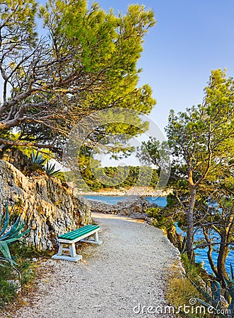 Pathway, bench and sea at Makarska, Croatia Stock Photo