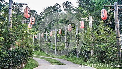 Pathway decorate with red chinese lantern in village tribeChinese word on latern is mean happy and lucky Stock Photo