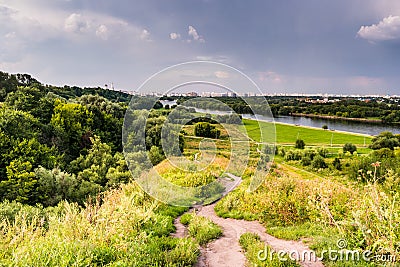 Pathway on a hill with wildflowers Stock Photo