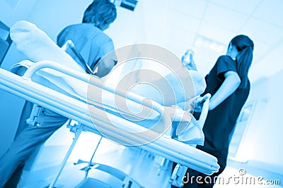Patient on the bed being taken along the corridor in the hospital Stock Photo