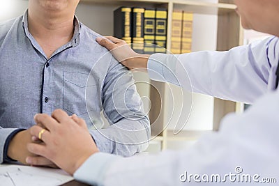 Patient Being Reassured desperate holding hand By Doctor encouraging support and comforting with sympathy. In Hospital Room Stock Photo