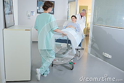 Patient being wheeled on hospital stretcher Stock Photo