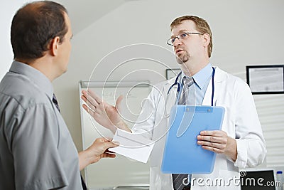 Patient bribing doctor Stock Photo