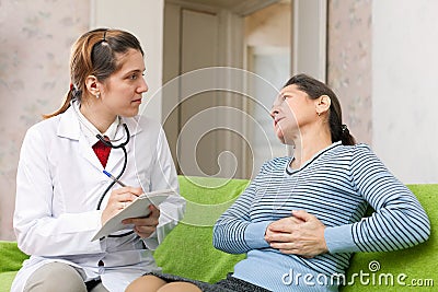 Patient complaining of pain in heart to doctor Stock Photo