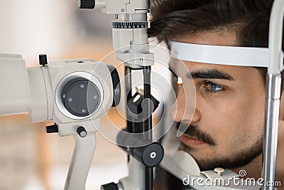 Patient or customer at slit lamp at optometrist or optician Stock Photo