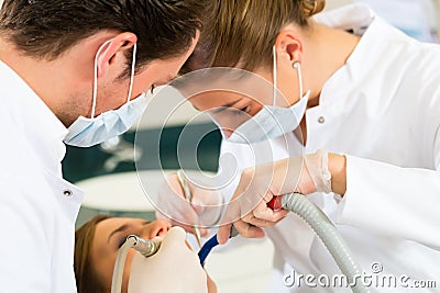 Patient with Dentist - dental treatment Stock Photo