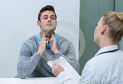 Patient discussing his problem with female patient Stock Photo