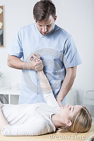 Patient doing exercises with therapist Stock Photo