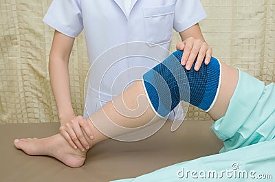 Patient doing physical exercises with physical therapist Stock Photo