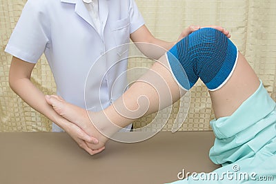 Patient doing physical exercises with physical therapist Stock Photo