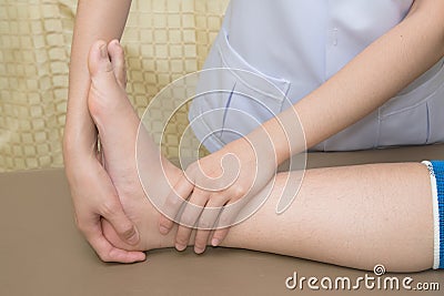 Patient doing physical exercises with physical therapist Stock Photo