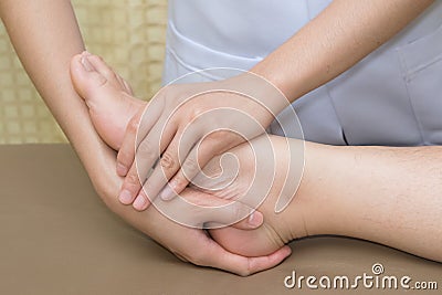Patient doing physical exercises with physical therapist Stock Photo