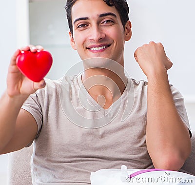 Patient getting blood transfusion in hospital clinic Stock Photo