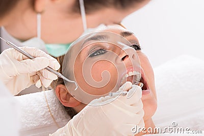 Patient Getting Dental Checkup At Clinic Stock Photo