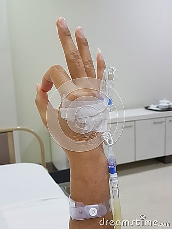 Close-up of patient hand showing OK symbol; in meaning it alright; at hospital room Stock Photo