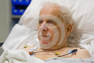 Patient hooked up to EKG monitor Stock Photo