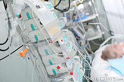 Patient on intensive care connected to devices for perfusion of Stock Photo
