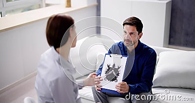 Patient Looking At Rorschach Inkblot Held Stock Photo