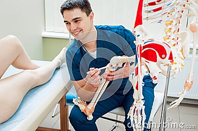 Patient with orthopedist doctor in his office. Stock Photo