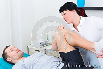 Physiotherapist medicate patient in practice Stock Photo