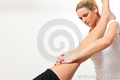 Patient at the physiotherapy doing physical therapy Stock Photo