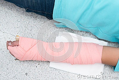 Patient`s Arm were unite with cardboard and elastic bandage. Closed-up. Stock Photo