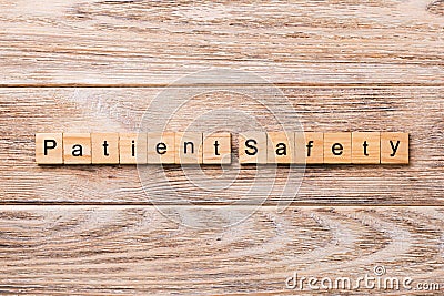 Patient Safety word written on wood block. Patient Safety text on wooden table for your desing, concept Stock Photo
