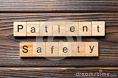 Patient Safety word written on wood block. Patient Safety text on wooden table for your desing, concept Stock Photo