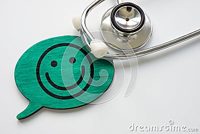 Patient satisfaction concept. Stethoscope and smiley face. Stock Photo