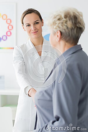 Patient thanking smiling dietician Stock Photo