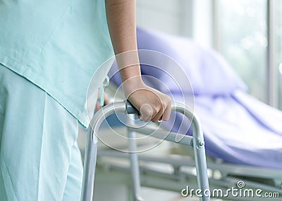 Patient use a walker after accident and cures Stock Photo