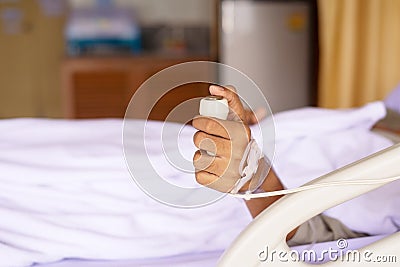 Patient using nurse alarm button for emergency belled on sickbed at hospital Stock Photo