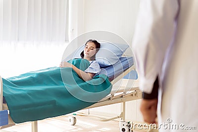 Patients asian female sleeping under blanket on sickbed at the hospital Stock Photo