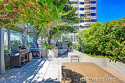 Patio area with barbecue. Residential building in downtown, Seat Stock Photo