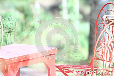 Patio Furniture Vintage Red Chair table Green Background Stock Photo