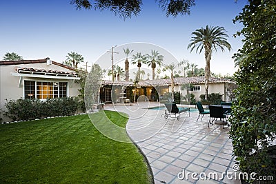 Patio With Pool In Front Of Modern House Stock Photo