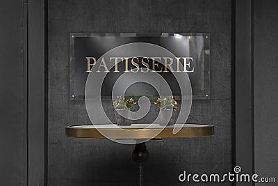 Patisserie sign board on wall Stock Photo