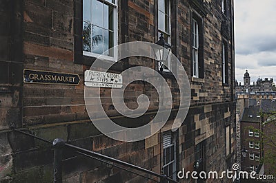 Patrick Gedges Steps and Grassmarket signages on a building wall in Old Town Edinburgh, Scotland, UK Stock Photo