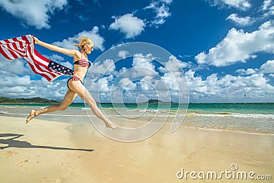 Patriotic woman jumping Stock Photo