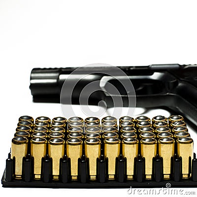 Patrons for a traumatic pistol stand in a black plastic form for cartridges. Weapons Stock Photo