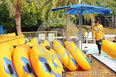 Pattaya, Thailand - 3 April 2019. Water park. Yellow inflatable rafts for the water Park. water Park swimming circle Editorial Stock Photo