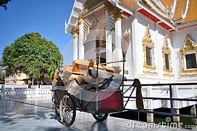 Cart of cleaning staff outside Buddhist temple Stock Photo