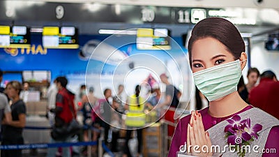 PATTAYA, THAILAND - FEBRUARY 4, 2020: air hostess welcome standee wearing protect mask at check-in area, U-Tapao International Editorial Stock Photo