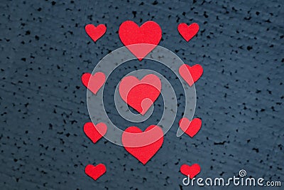 Pattern of bright red hearts on a black background Stock Photo