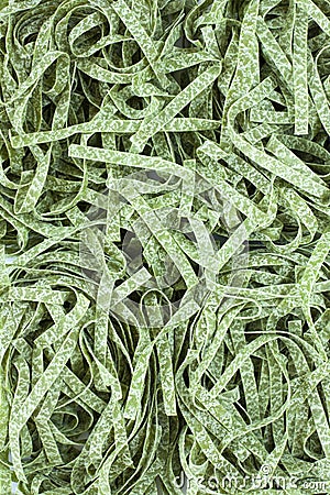 Pattern dry pasta spinach tagliatelle, fettuccine nests Stock Photo